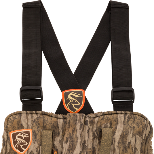 Youth Silencer Bib with Agion Active XL, featuring camouflage design, straps, vertical pockets, and scent control technology for enhanced hunting performance.