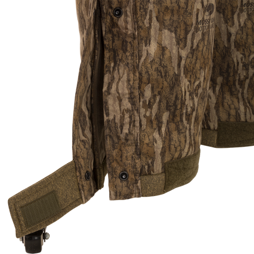 Close-up of the Youth Silencer Bib with Agion Active XL featuring vertical pockets and Sherpa fleece interior for hunting gear warmth and scent control.