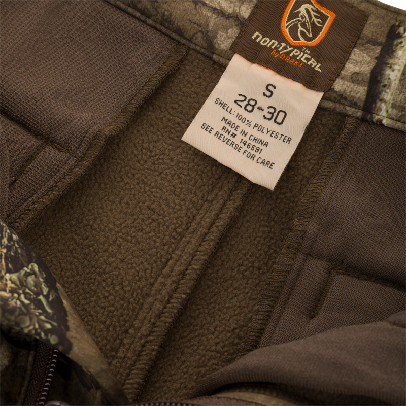 Close-up of the Non-Typical Endurance Pant's clothing label, emphasizing the high-quality craftsmanship and performance features for hunting.