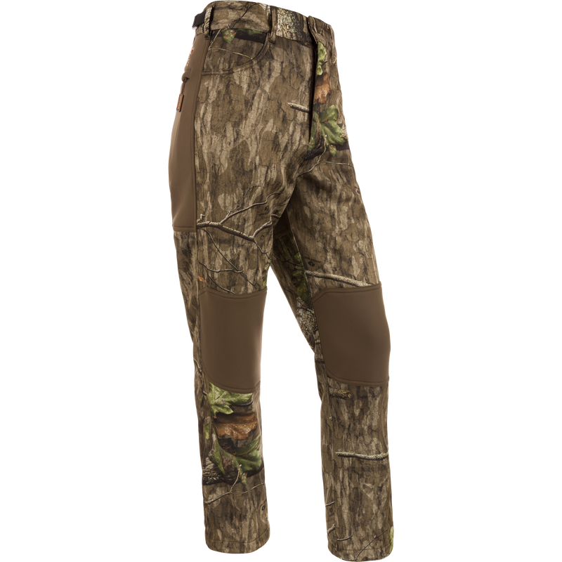 Non-Typical Endurance Pant with camouflage pattern, featuring front slash pockets, rear pockets, and adjustable waist, designed for comfort and protection in mid-season hunting.