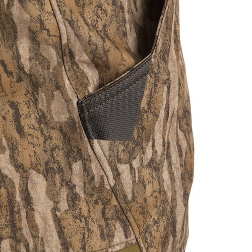 Close-up of the EST Stretch Tech Pants with Scent Control, showcasing a front slash pocket with built-in knife sheath on camouflage fabric.