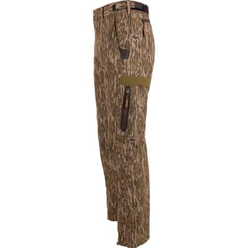 Pair of EST Camo Tech Stretch Pants with Scent Control, showcasing adjustable outer waistband, multiple zippered pockets, and elastic ankle cinch cord for versatile hunting comfort.