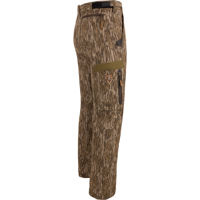 Pair of EST Stretch Tech Pants with Scent Control featuring camouflage pattern, multiple zippered pockets, and adjustable waistband, ideal for versatile hunting and outdoor activities.