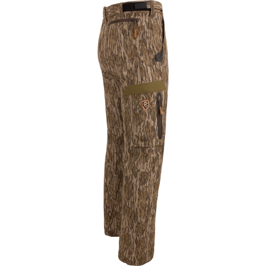 Pair of EST Stretch Tech Pants with Scent Control featuring camouflage pattern, multiple zippered pockets, and adjustable waistband, ideal for versatile hunting and outdoor activities.