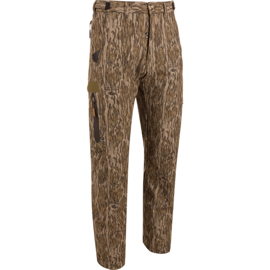 EST Stretch Tech Pants with Scent Control: Lightweight, camouflage hunting pants featuring multiple zippered pockets, adjustable waistband, and elastic ankle cinch cord for enhanced comfort and mobility.