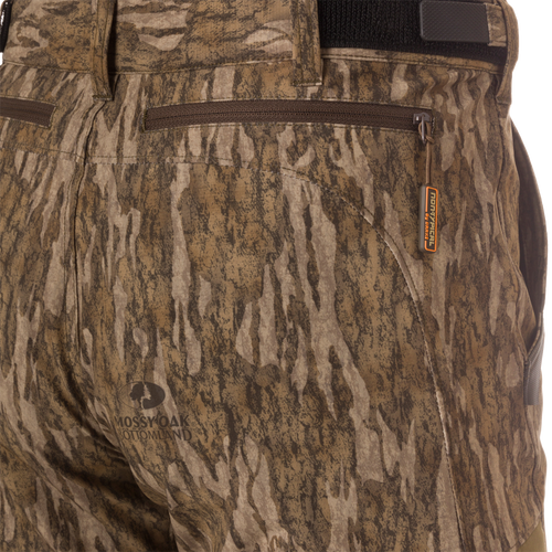 Close-up of EST Camo Tech Stretch Pants featuring zippered fly, side cargo pockets, and elastic ankle cinch cord for versatile hunting comfort and scent control.