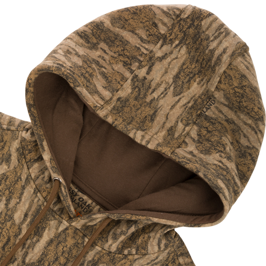 Non-Typical Three-End Camo Hoodie with kangaroo pocket, lined hood, adjustable drawstrings, and zipper details, shown in close-up.