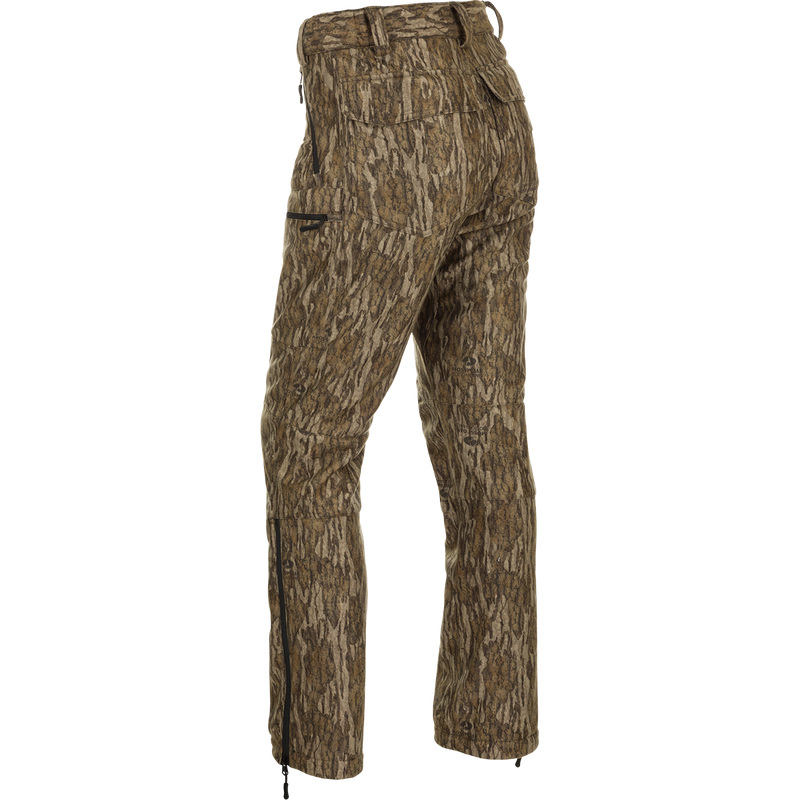 MST Microfleece Softshell Pant with Scent Control, showcasing camouflage design, side-elastic waist, articulated knees, and zippered pockets for superior comfort and functionality.