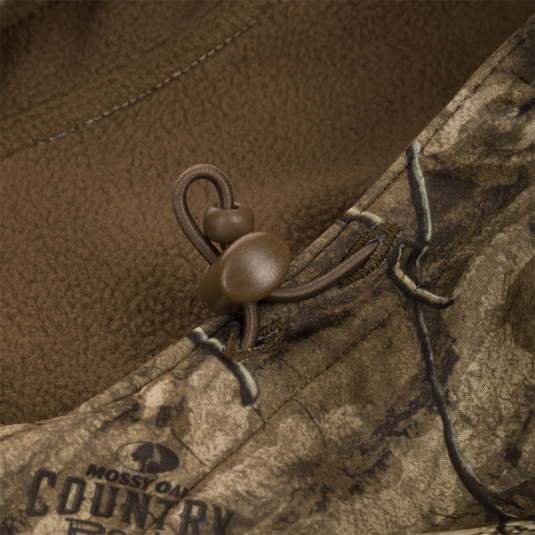 Close-up of a button on the Non-Typical Endurance Hooded Full Zip Jacket, highlighting its soft, silent fleece fabric designed for mid-season hunting comfort.