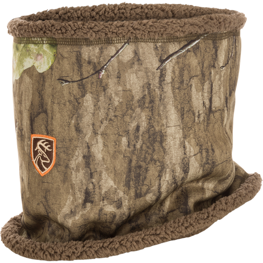 Non-Typical Silencer Sherpa Fleece Neck Gaiter with Agion Active XL, featuring camo design and logo. Ideal for hunting, with scent-control technology and cozy sherpa fleece lining.