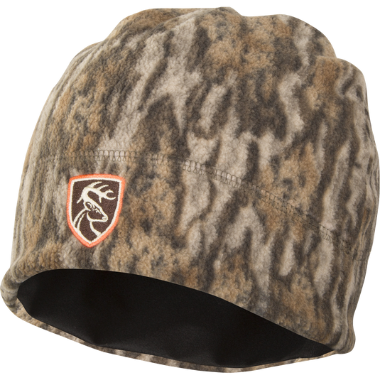 Non-Typical Camo Windproof Fleece Beanie with logo, featuring deep-cut design for ear coverage and windproof fleece fabric.