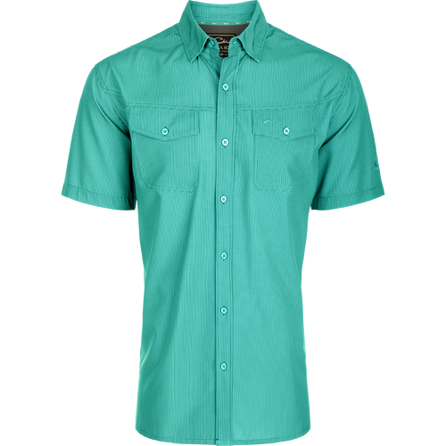 Traveler's Check Button-Down Short Sleeve Shirt with a checkered pattern, featuring two chest pockets with button flaps, designed for comfort and mobility.