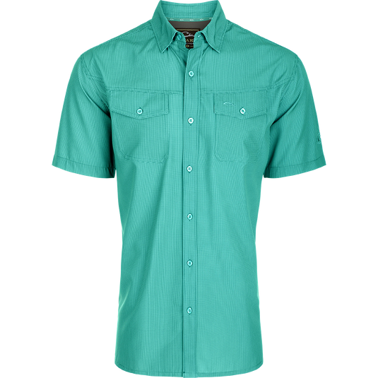 Traveler's Check Button-Down Short Sleeve Shirt with a checkered pattern, featuring two chest pockets with button flaps, designed for comfort and mobility.