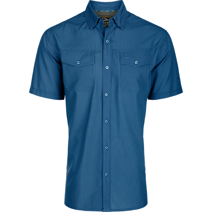 Traveler's Check Button-Down Short Sleeve Shirt made of lightweight, breathable poly/spandex fabric with two chest pockets and button flaps, ideal for travel and casual wear.