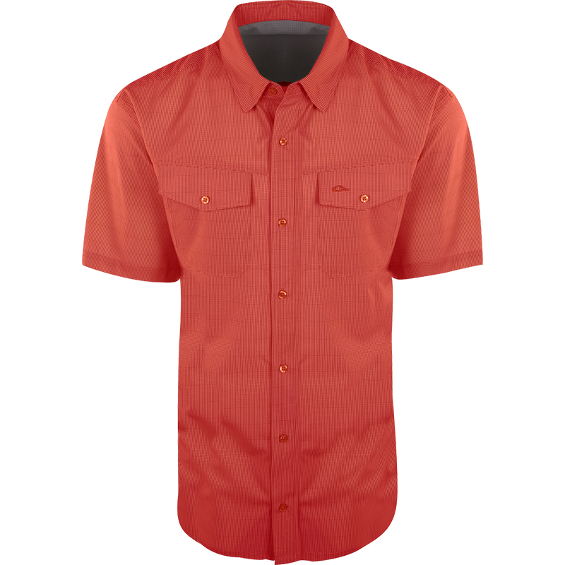 Traveler's Check Button-Down Short Sleeve Shirt with two chest pockets, button flaps, and a collar, designed for comfort and mobility with four-way stretch fabric.