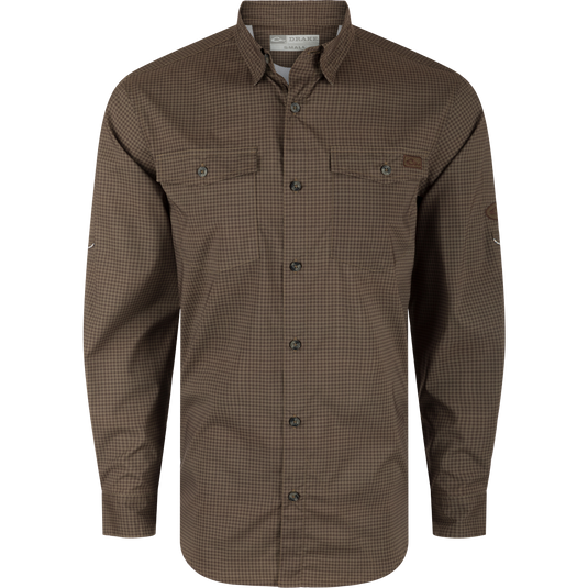 A brown Frat Gingham Check Button-Down Shirt with hidden collar, chest pockets, and vented back. Lightweight, moisture-wicking fabric with UPF30 sun protection and sculpted hem. Ideal for hunting and outdoor activities.