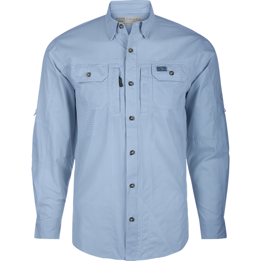 A performance-driven Drake Frat Houndstooth Check Button-Down Shirt in blue. Features include UPF30 sun protection, moisture-wicking fabric, hidden collar, chest pockets, and adjustable sleeves. Ideal for hunting and outdoor activities.