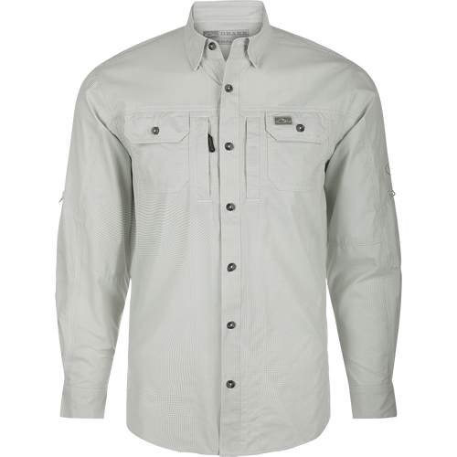 A technical houndstooth check shirt by Drake Waterfowl. Features include UPF30 sun protection, moisture-wicking fabric, hidden collar, chest pockets, and a sculpted hem for versatile wear.