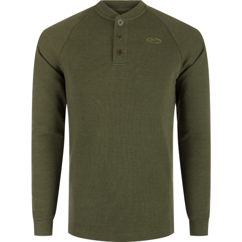 A durable Weston Lakes Waffle Henley in green, featuring raglan sleeves, metal logo buttons, ribbed collar, cuffs, and split tail hem. Ideal for hunting and outdoor activities.