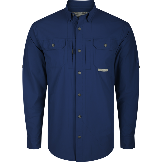 Wingshooter Trey Shirt L/S with long sleeves, hidden button-down collar, two chest pockets, vented cape back, and adjustable roll-up sleeves. High-performance fabric features.