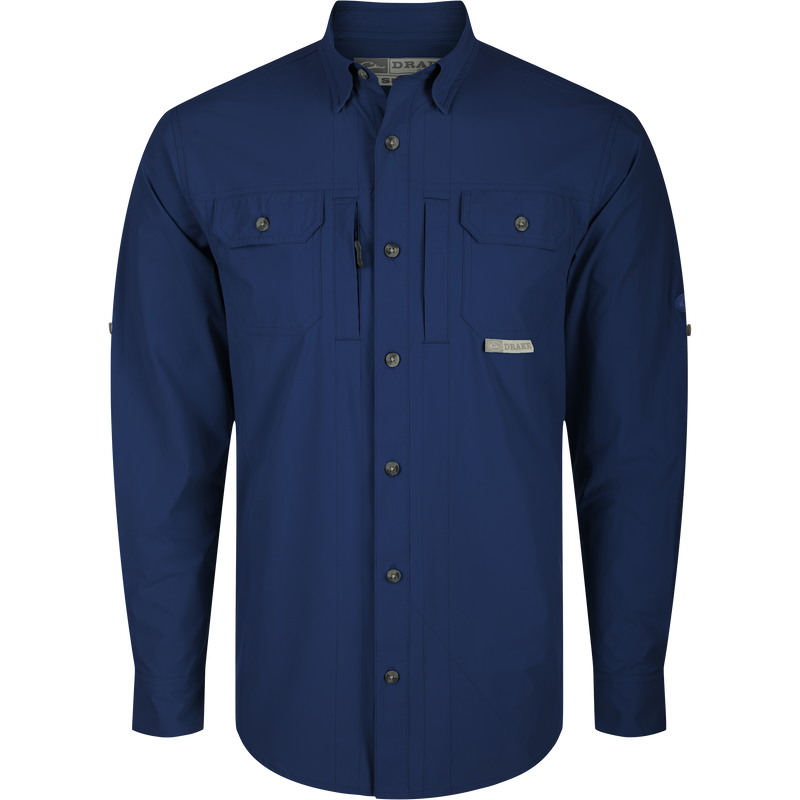 Wingshooter Trey Shirt L/S with long sleeves, hidden button-down collar, two chest pockets, vented cape back, and adjustable roll-up sleeves. High-performance fabric features.