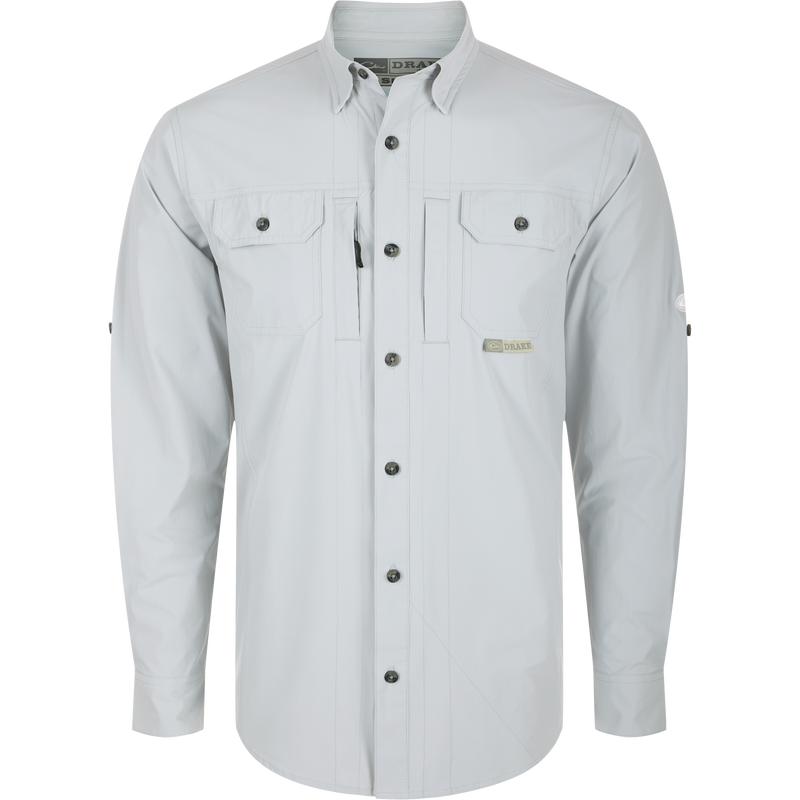 Long-sleeved white Wingshooter Trey Shirt with hidden button-down collar, two chest pockets, vented cape back, and adjustable roll-up sleeves.