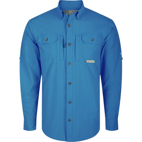 Wingshooter Trey Shirt L/S: A blue long-sleeved shirt with a hidden button-down collar, two chest pockets, and a vented back for moisture wicking and UPF 30 sun protection.