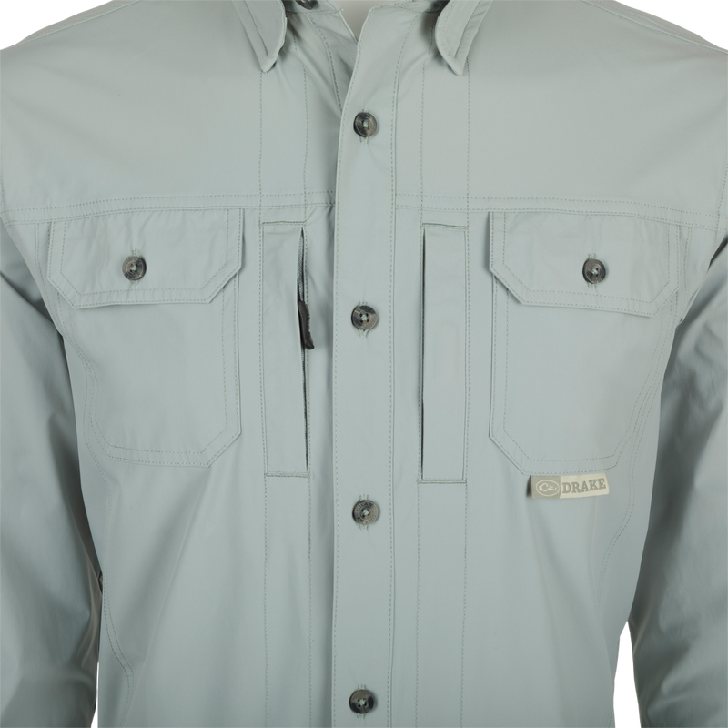 Close-up of a Drake Wingshooter Trey Shirt L/S featuring a button-down collar, chest pockets, and vented back for enhanced performance and comfort.