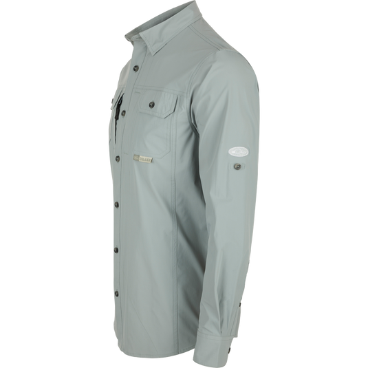 Wingshooter Trey Shirt L/S: Long-sleeved, performance fabric with hidden button-down collar, two chest pockets, vented cape back, adjustable sleeves, and sunglass wipe.