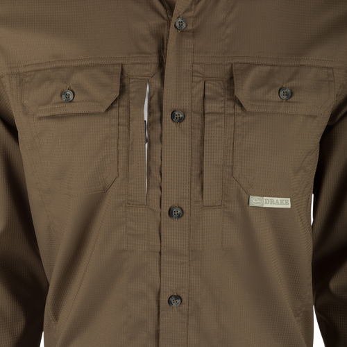 Close-up of the Wingshooter's Trey Dobby Button-Down Long Sleeve Shirt, highlighting the textured fabric, button-through flap chest pocket, and hidden button-down collar.