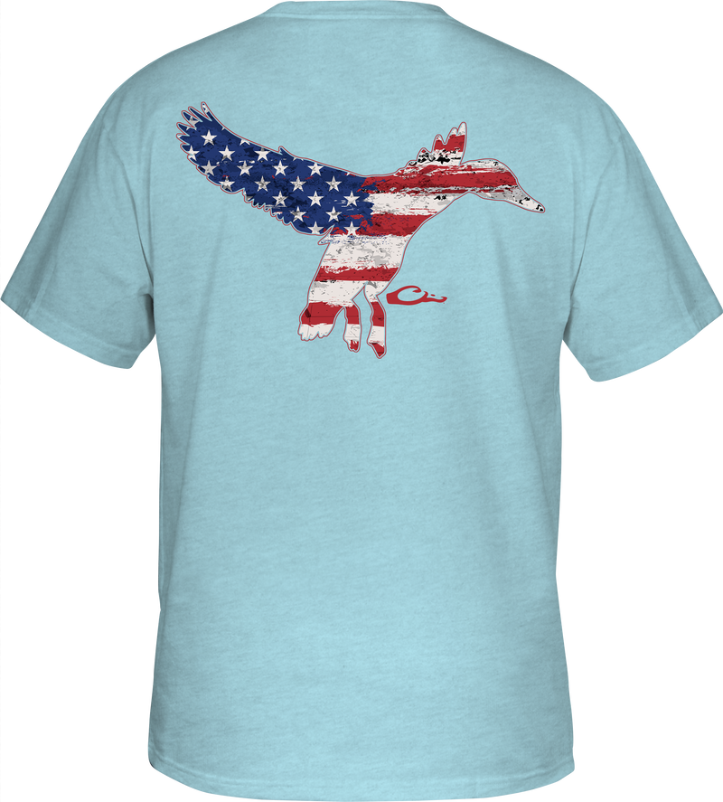 Flying Duck Flag T-Shirt featuring a fox with an American flag design on the back, part of Drake Waterfowl's Americana Series, emphasizing hunting and outdoor apparel.