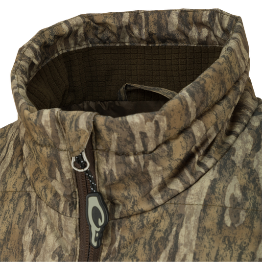 Close-up of the MST Synthetic Down Pack Jacket, highlighting the durable zipper and abrasion-resistant fabric, designed for versatile hunting and outdoor activities.