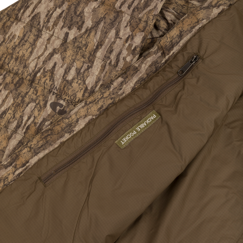 Close-up of the MST Synthetic Down Pack Jacket, highlighting the durable zipper and abrasion-resistant shell, showcasing its packable and versatile design.