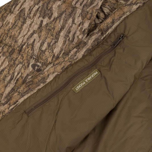 Close-up of the MST Synthetic Down Pack Jacket, highlighting the durable zipper and abrasion-resistant shell, showcasing its packable and versatile design.