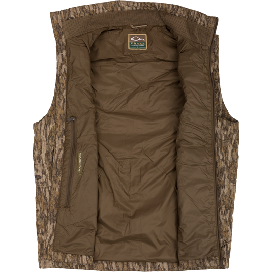 MST Synthetic Down Pack Vest with reinforced elbow patches, zippered slash pockets, and drawcord adjustable waist, designed for versatile warmth and packability.