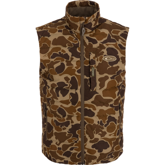 Camouflage MST Synthetic Down Pack Vest with horizontal baffle design, zippered pockets, and drawcord adjustable waist; packable into its own chest pocket.