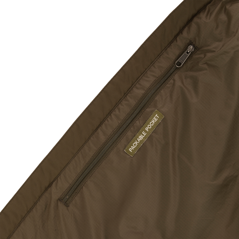 Close-up of the MST Synthetic Down Pack Vest zipper and label, highlighting the durable, matte-finish shell material and synthetic down insulation.