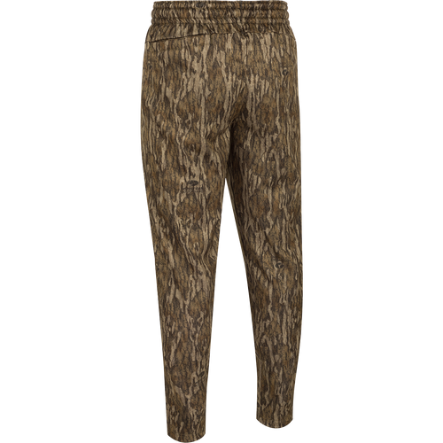 MST Waterfowl Under-Wader Jogger, featuring a camouflage pattern, tapered legs, front slash pockets, and Magnattach™ closure rear pockets, ideal for wearing under waders or lounging.