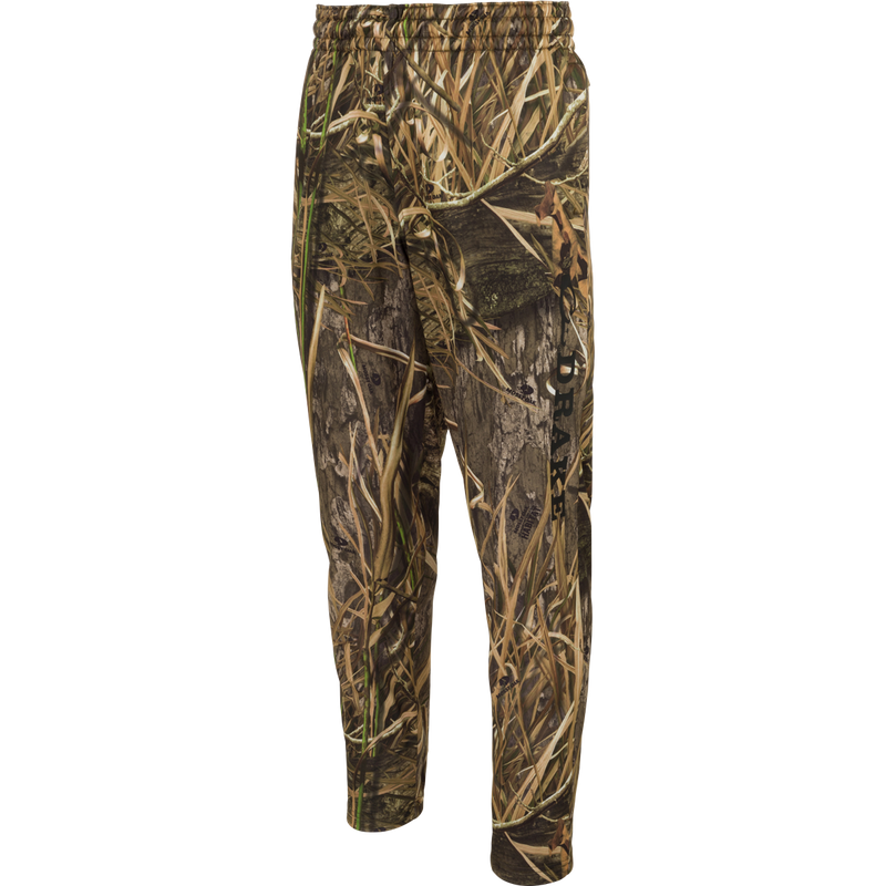 MST Waterfowl Under-Wader Jogger, featuring camouflage design, tapered legs, front slash pockets, and Magnattach™ closure rear pockets for convenient storage. Ideal for use under waders.