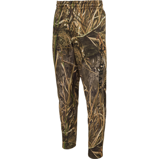 MST Waterfowl Under-Wader Jogger, featuring camouflage design, tapered legs, front slash pockets, and Magnattach™ closure rear pockets for convenient storage. Ideal for use under waders.