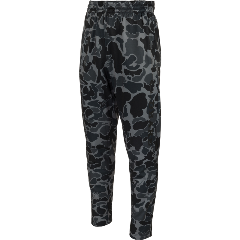 MST Waterfowl Under-Wader Jogger: Camouflage-patterned jogger pants with front slash pockets, Magnattach™ rear pockets, and tapered legs, designed for comfort under waders.