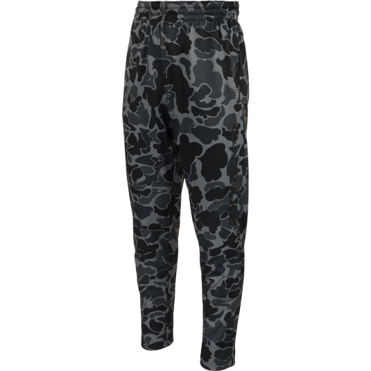 MST Waterfowl Under-Wader Jogger: Camouflage-patterned jogger pants with front slash pockets, Magnattach™ rear pockets, and tapered legs, designed for comfort under waders.