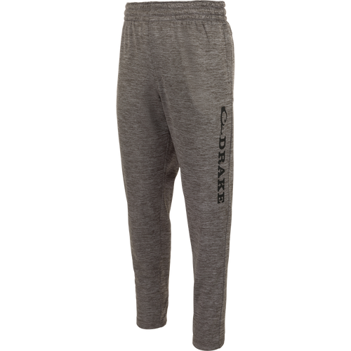 MST Waterfowl Under-Wader Jogger with black text, featuring front slash pockets, Magnattach™ closure rear pockets, and tapered legs for comfort under waders.