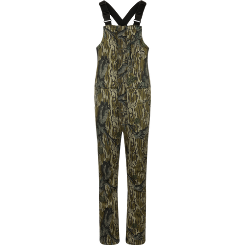 MST Ultimate Wader Bib: Camouflage overalls with straps, 4-way stretch, gusseted crotch, and articulated knees for easy movement. Sherpa-lined slash handwarmer pockets, Magnattach™ chest pocket, and zippered rear security pockets for storage. Ankle-fit for under waders.