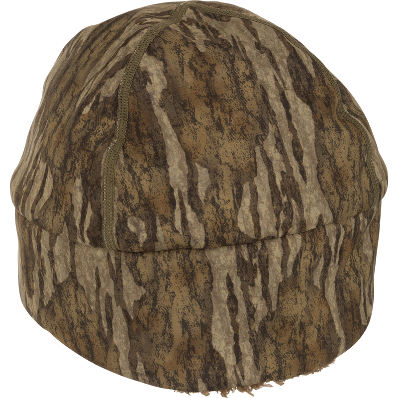 LST Windstopper Beanie: A close-up of a camouflaged hat made of high-quality hunting gear, perfect for big game hunting, waterfowl hunting, turkey hunting, and fishing.