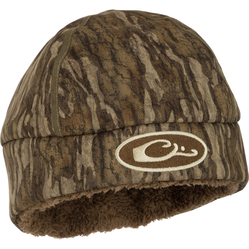 LST Windstopper Beanie: A camouflage hat with a logo, perfect for hunting and outdoor activities.