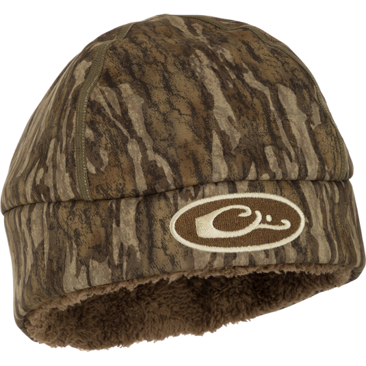 LST Windstopper Beanie: A camouflage hat with a logo, perfect for hunting and outdoor activities.