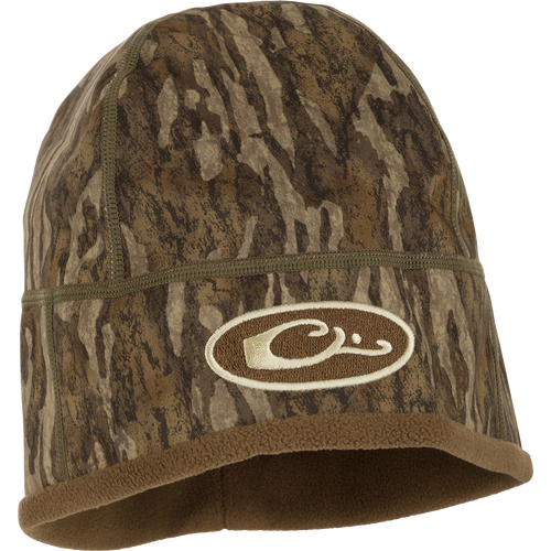 Camouflage MST Windstopper Beanie with logo, windproof, breathable, and ultra-soft, designed to cover ears for protection against cold and wind.