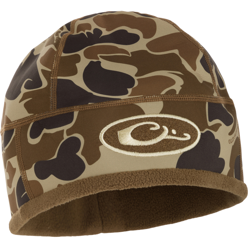 Camouflage MST Windstopper Beanie with logo, designed for windproof, breathable warmth, covering the ears for enhanced protection during mid-to-late season hunting.