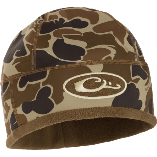 Camouflage MST Windstopper Beanie with logo, designed for windproof, breathable warmth, covering the ears for enhanced protection during mid-to-late season hunting.